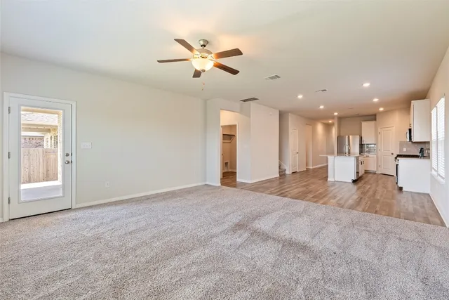 a view of a livingroom with a kitchen