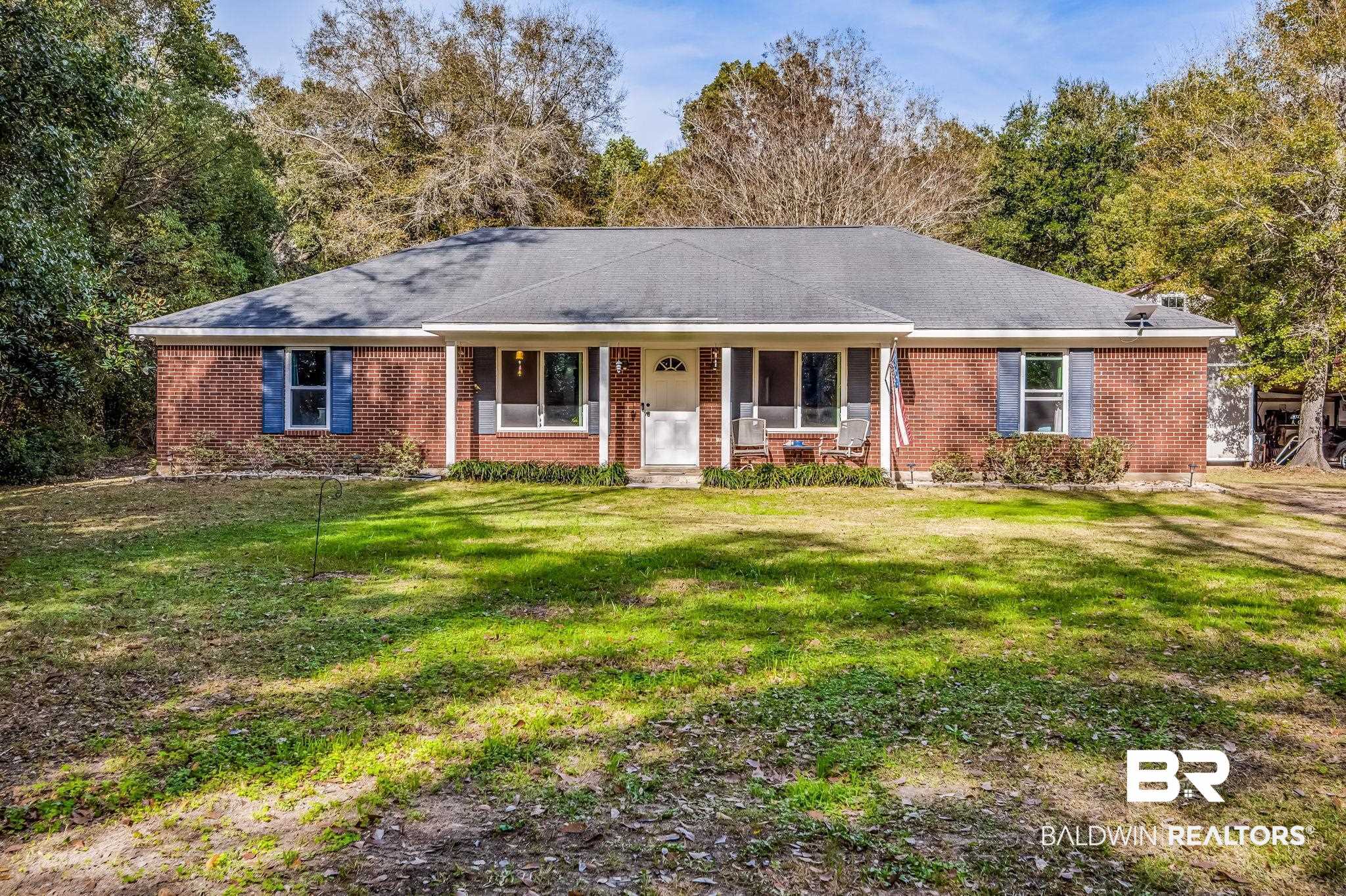 12199 Bay Road West Foley, AL 36535 - Photo 1 of 62 Ranch-style home with covered porch, a front yard, and brick siding