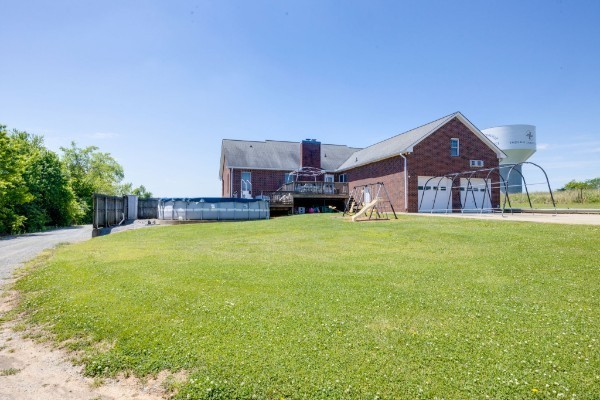 1224 Stop 30 Road Hendersonville, TN 37075 - Photo 5 of 11 a front view of a house with a big yard and large trees