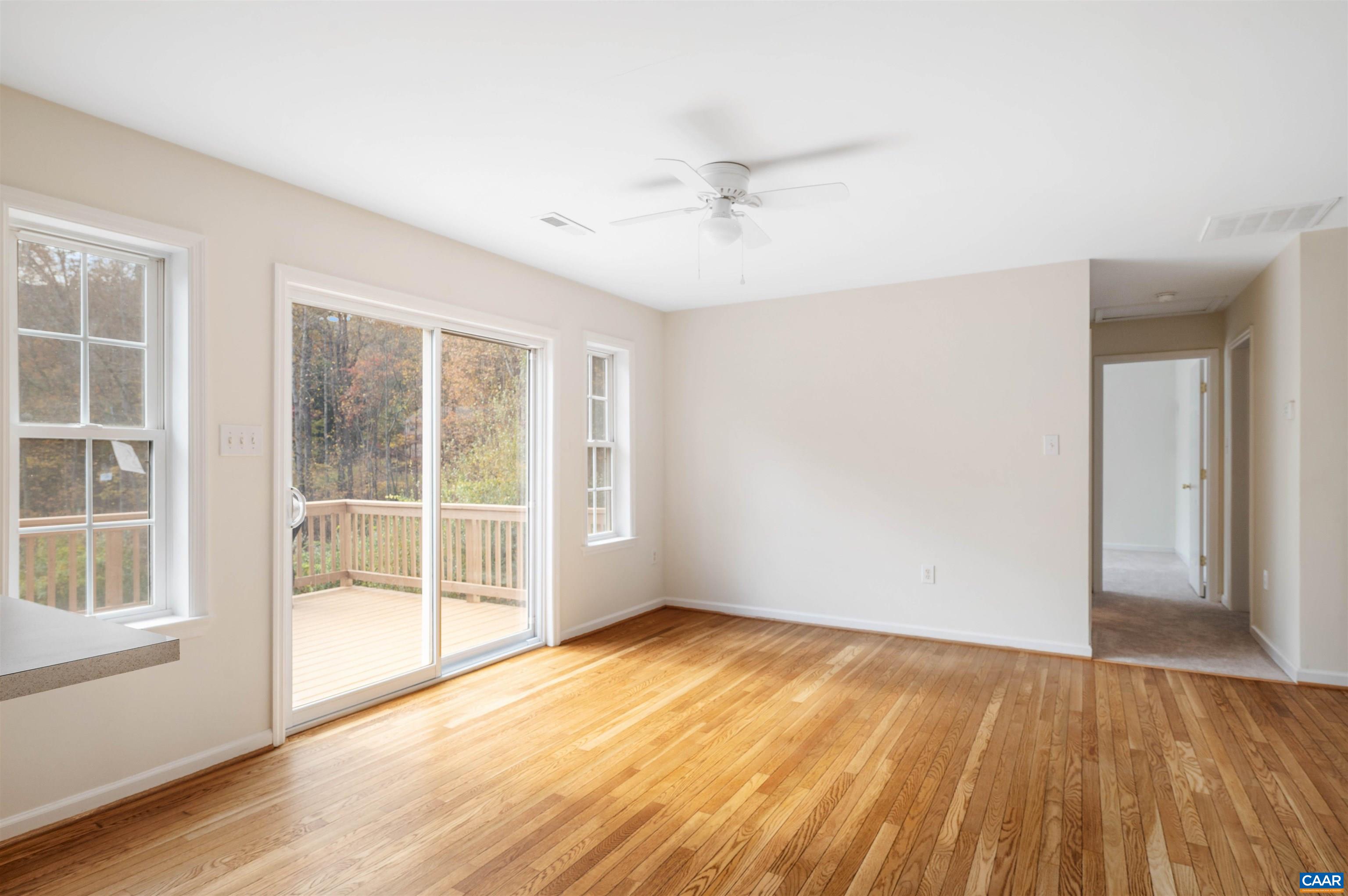 328 West Daffodil Road Ruckersville, VA 22968 - Photo 17 of 67 an empty room with wooden floor and windows