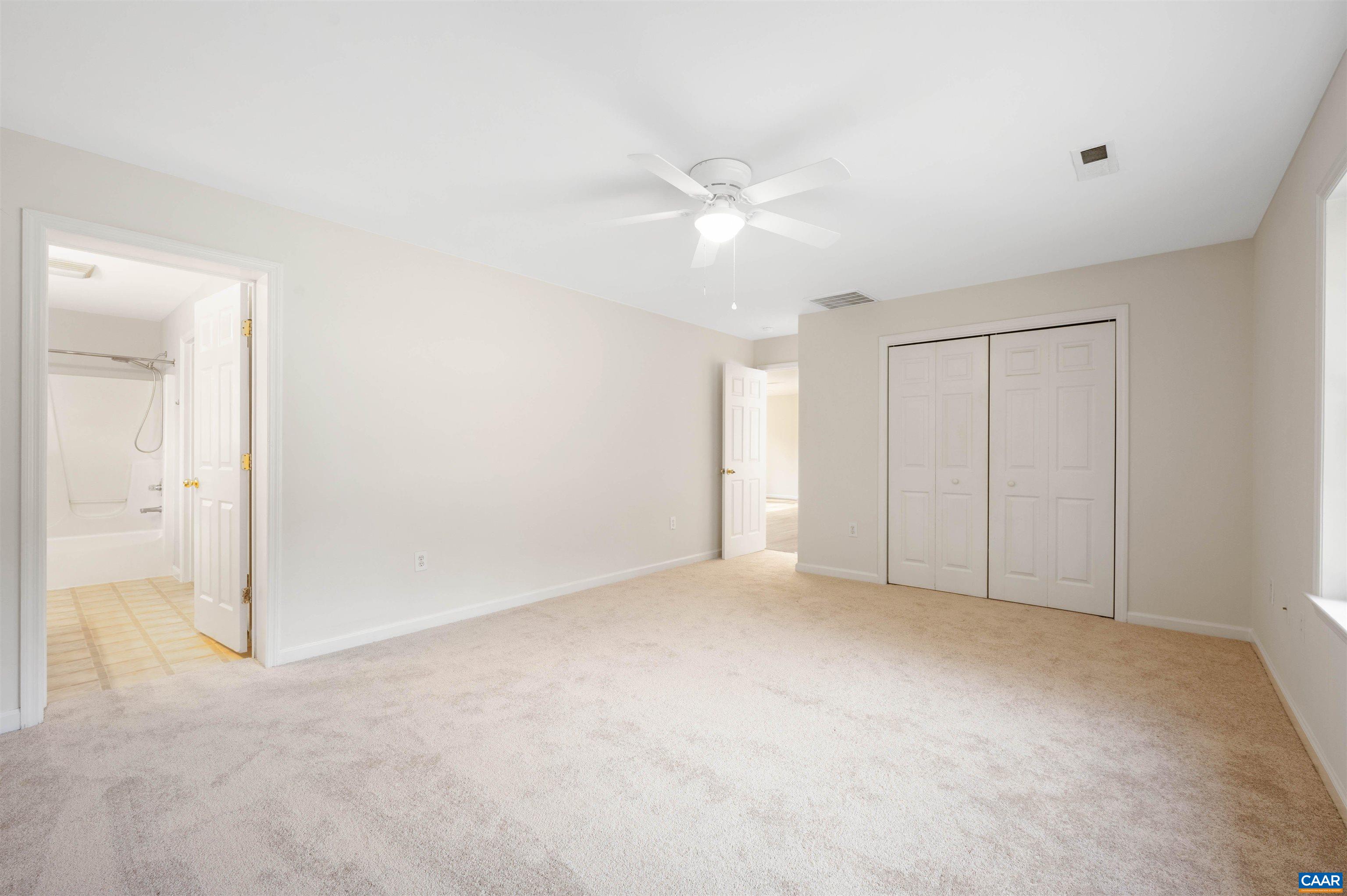 328 West Daffodil Road Ruckersville, VA 22968 - Photo 19 of 67 an empty room with a ceiling fan and a window