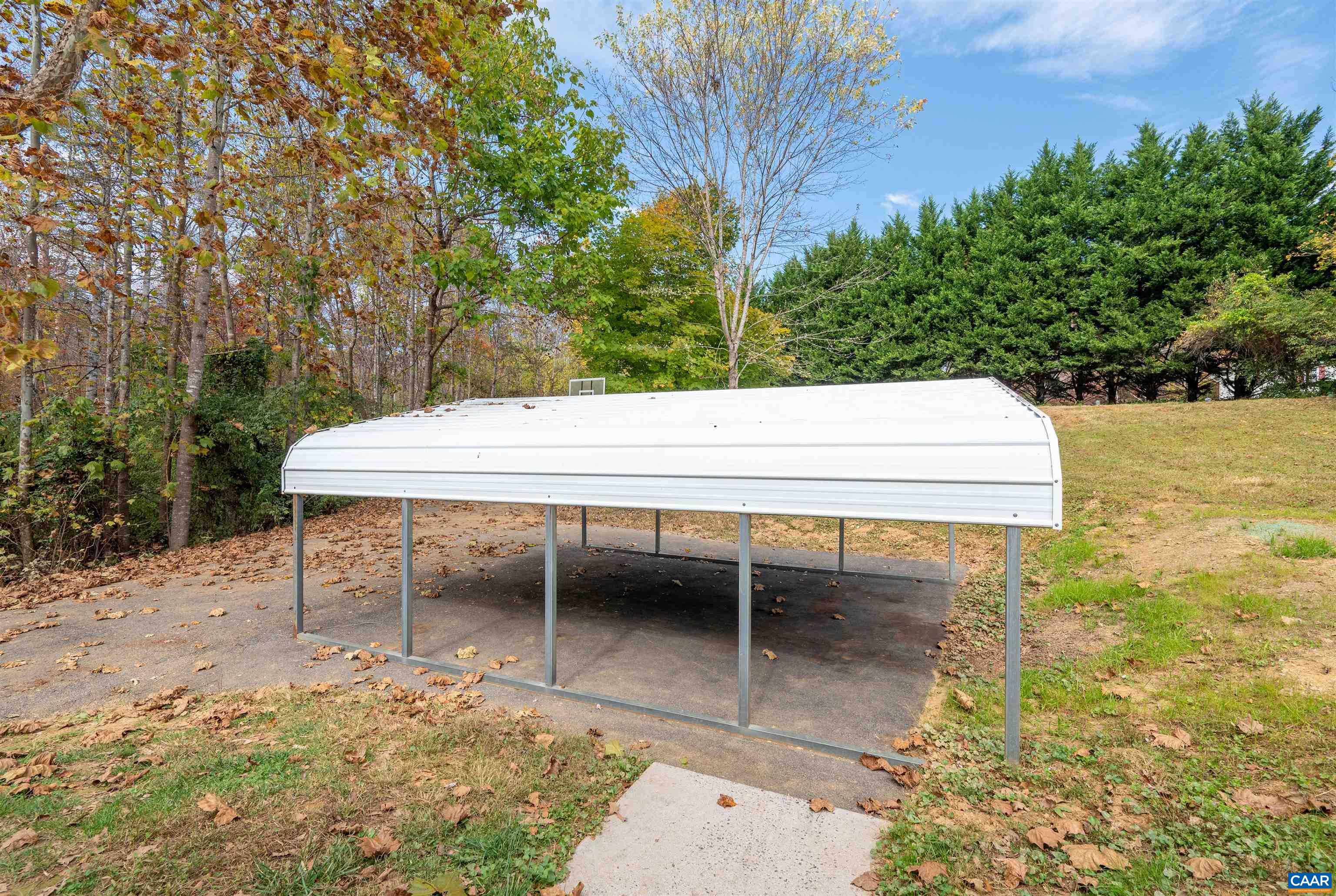 328 West Daffodil Road Ruckersville, VA 22968 - Photo 36 of 67 a view of a chairs and table in the patio