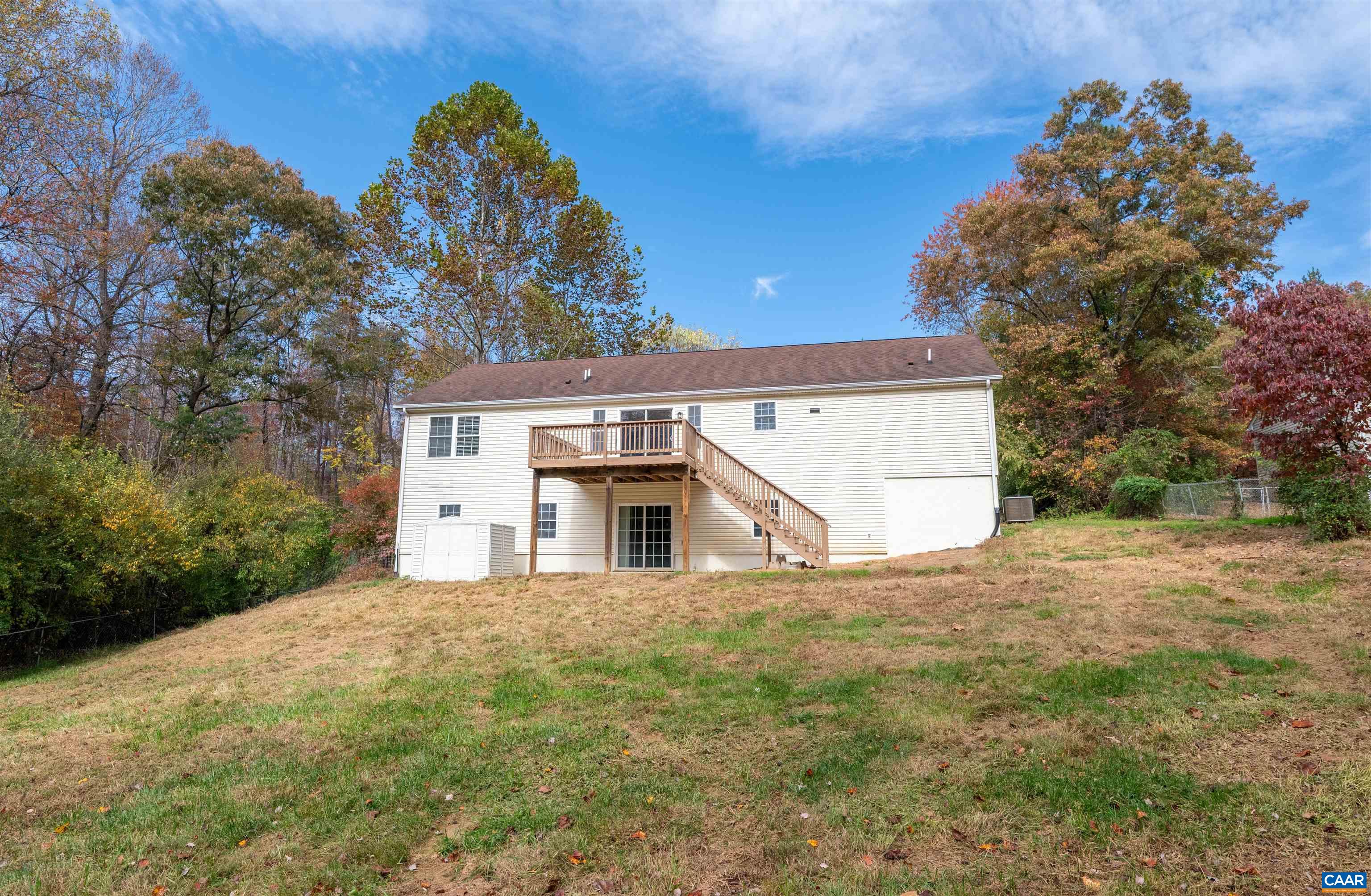 328 West Daffodil Road Ruckersville, VA 22968 - Photo 43 of 67 a view of a house with a yard and a garage