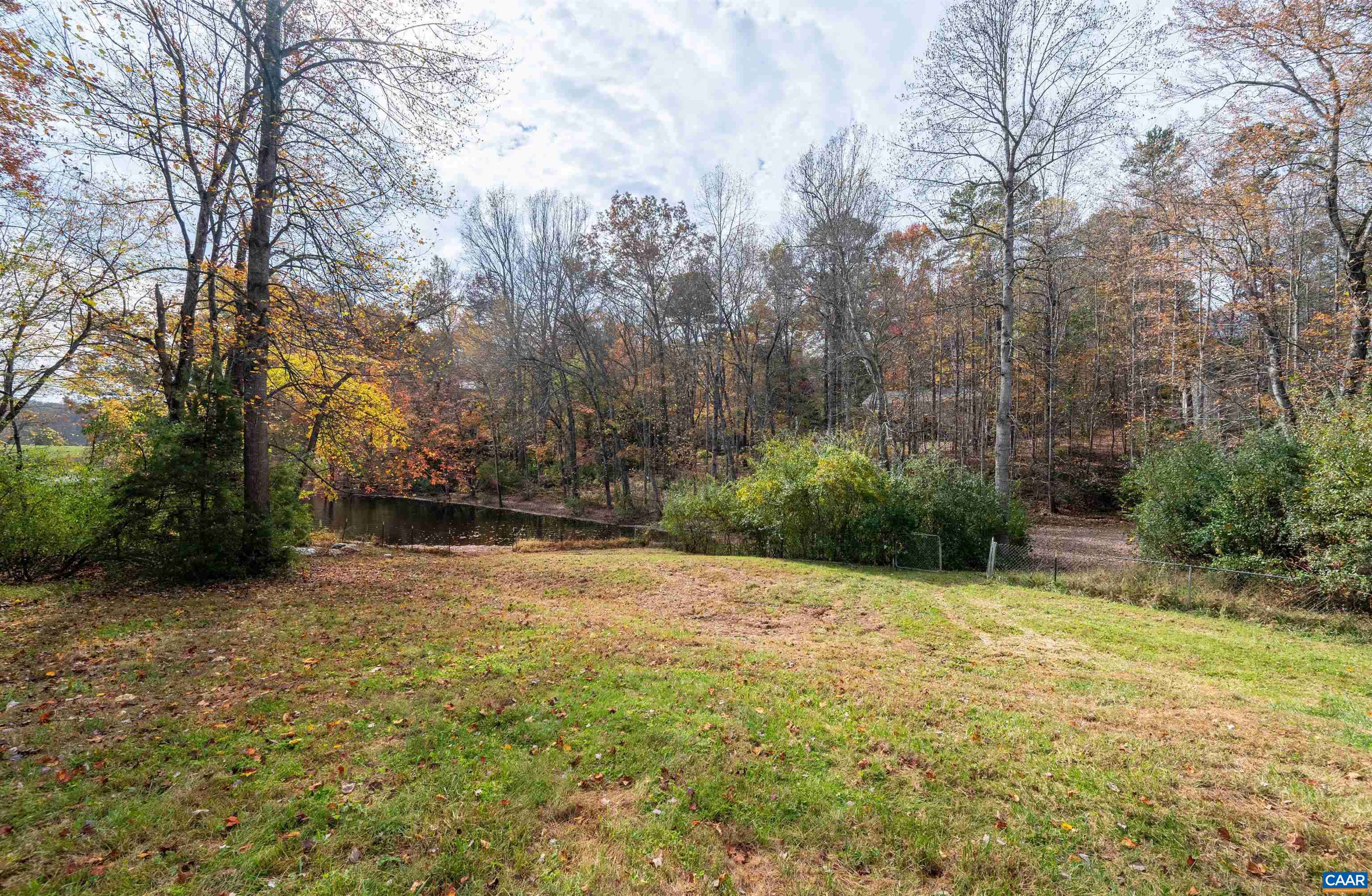 328 West Daffodil Road Ruckersville, VA 22968 - Photo 47 of 67 a backyard of a house with lots of green space