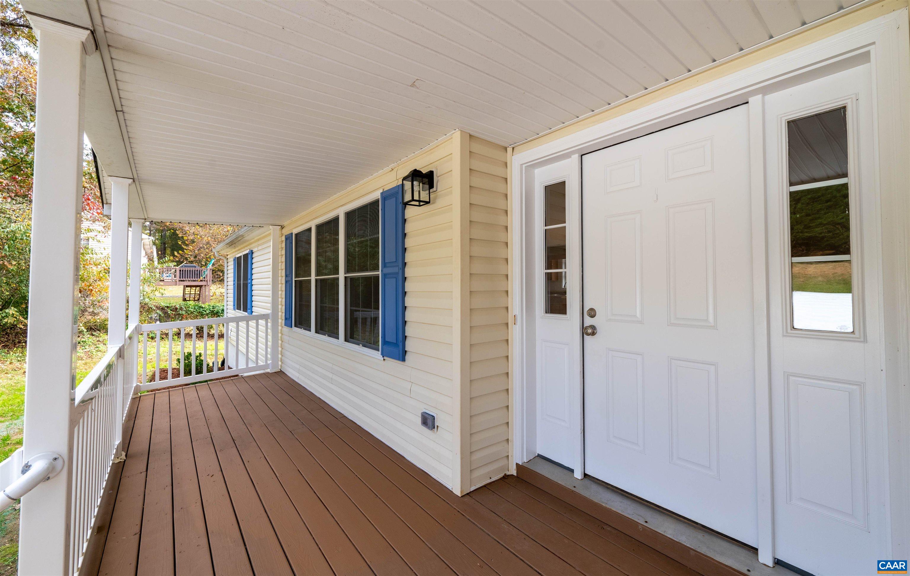 328 West Daffodil Road Ruckersville, VA 22968 - Photo 5 of 67 a view of front door deck and wooden floor