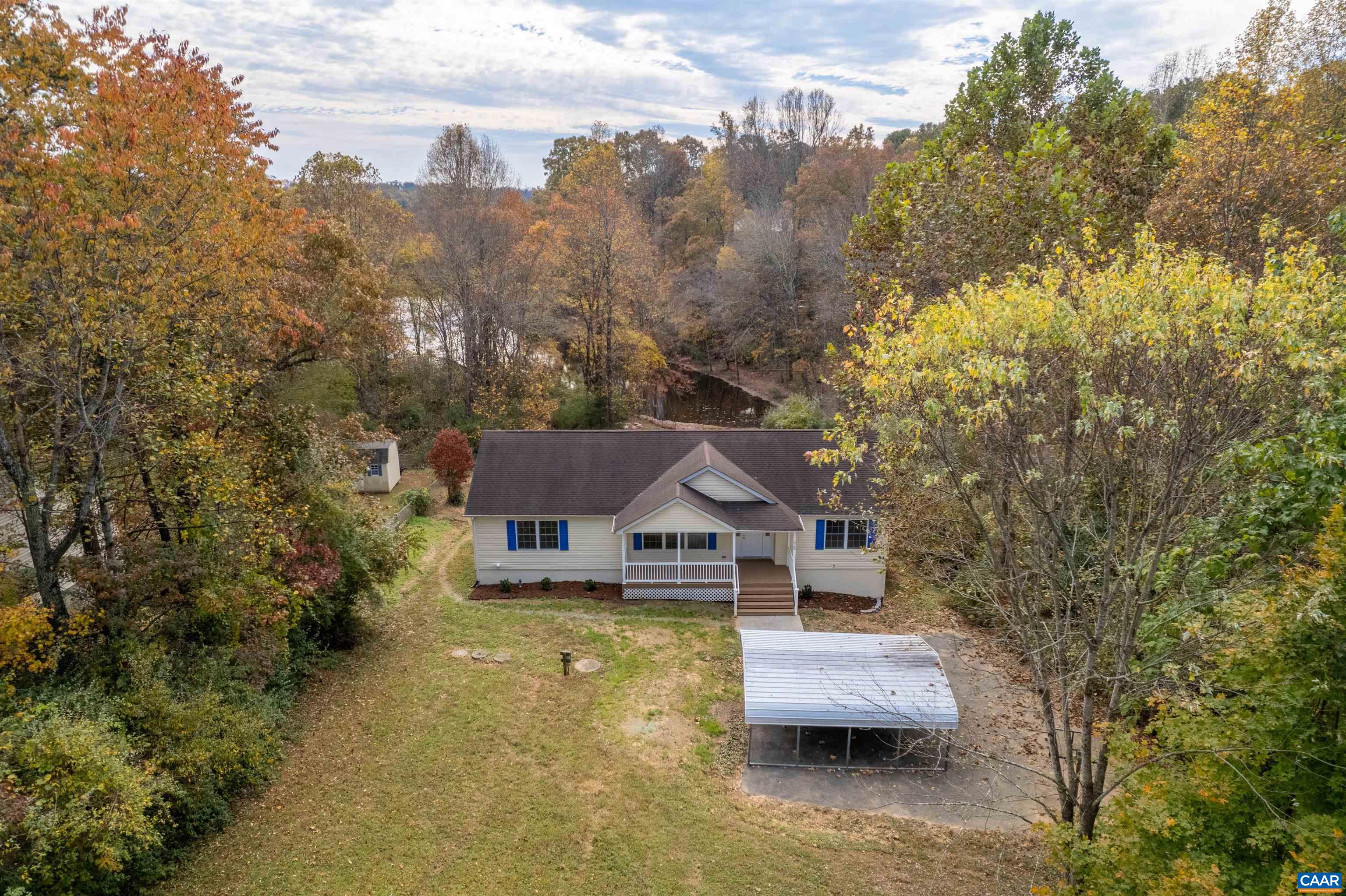 328 West Daffodil Road Ruckersville, VA 22968 - Photo 51 of 67 a front view of a house with a garden