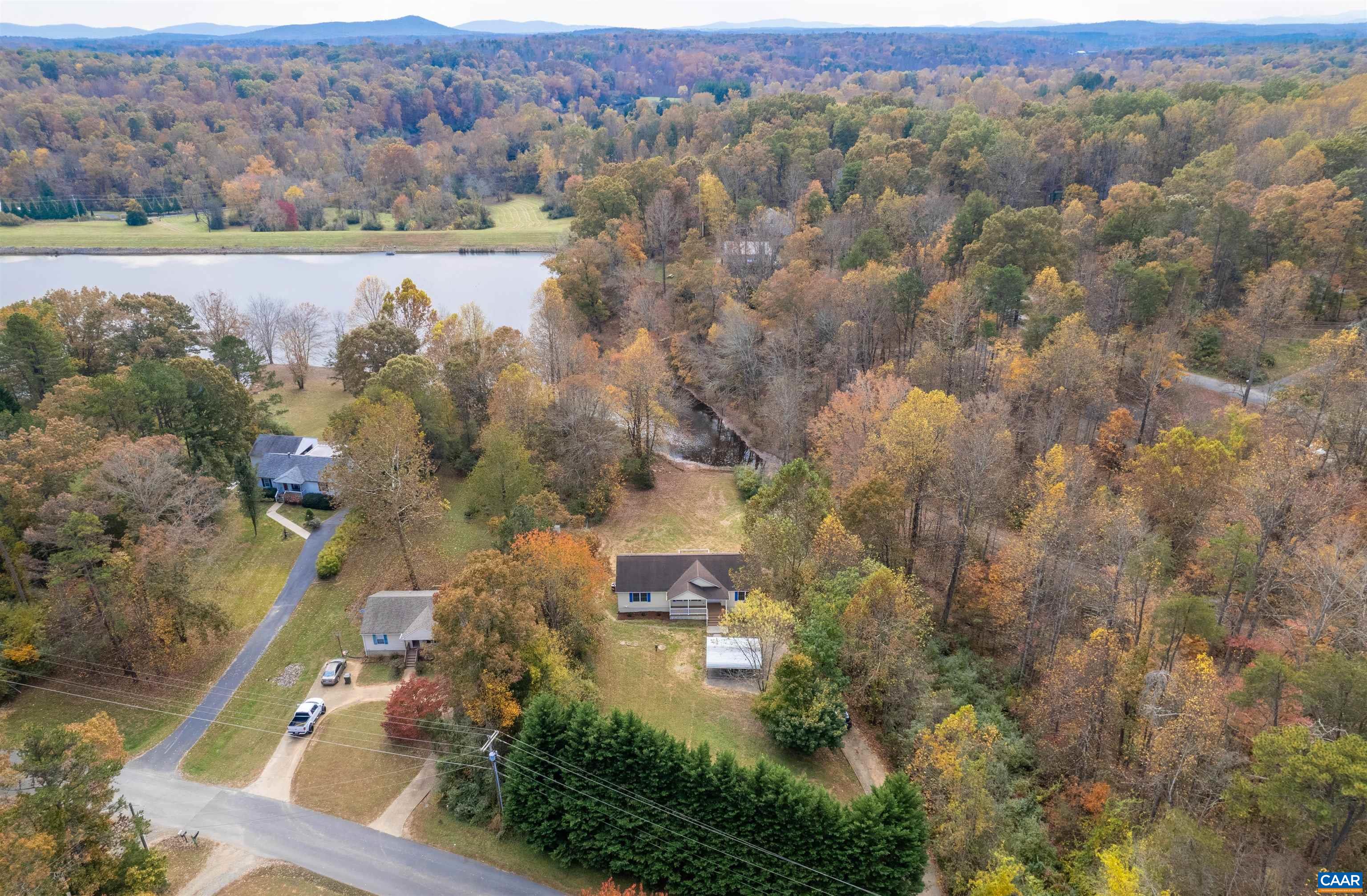 328 West Daffodil Road Ruckersville, VA 22968 - Photo 56 of 67 an aerial view of a houses with outdoor space and trees