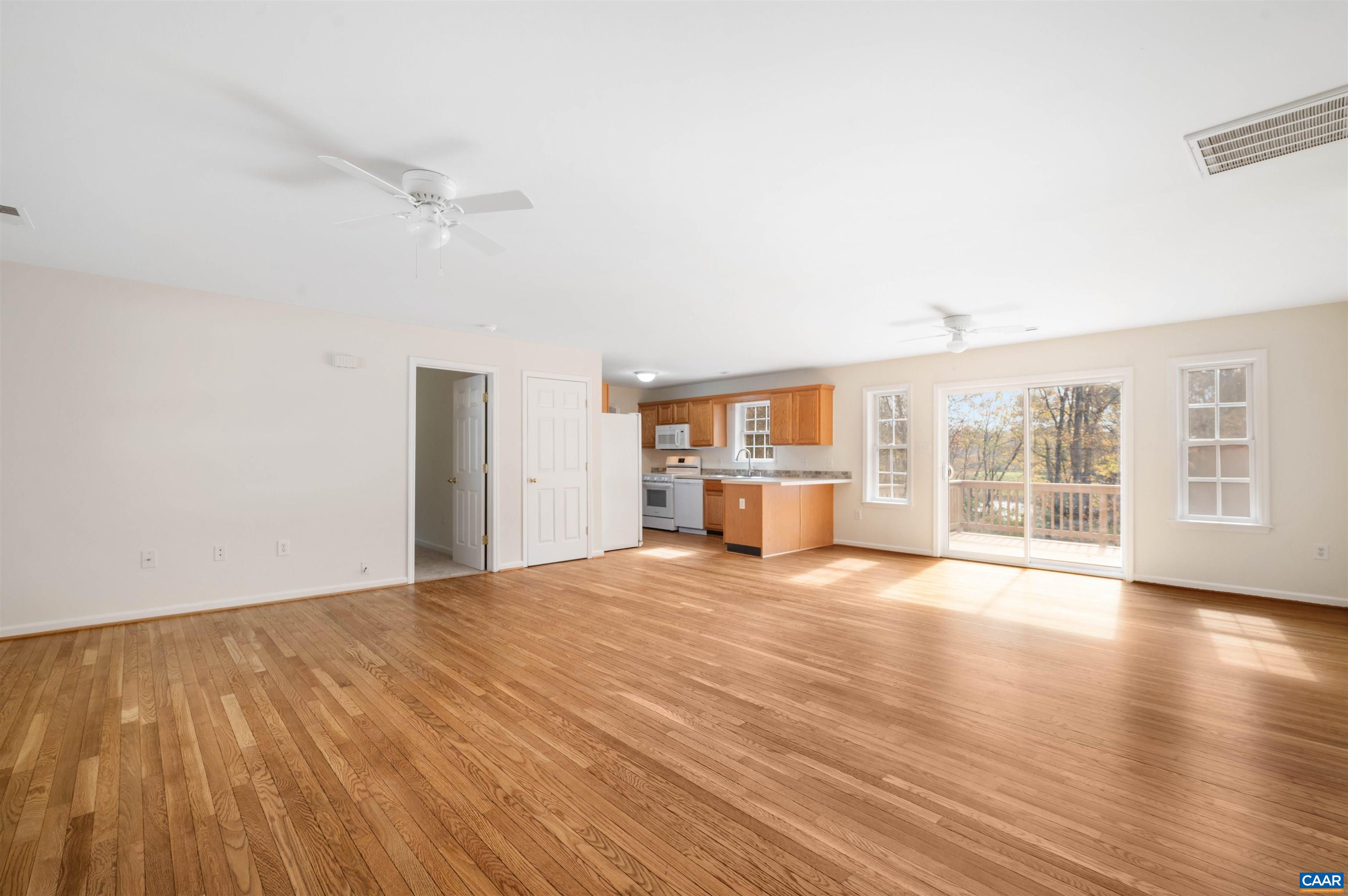 328 West Daffodil Road Ruckersville, VA 22968 - Photo 6 of 67 a view of an empty room with a window and wooden floor