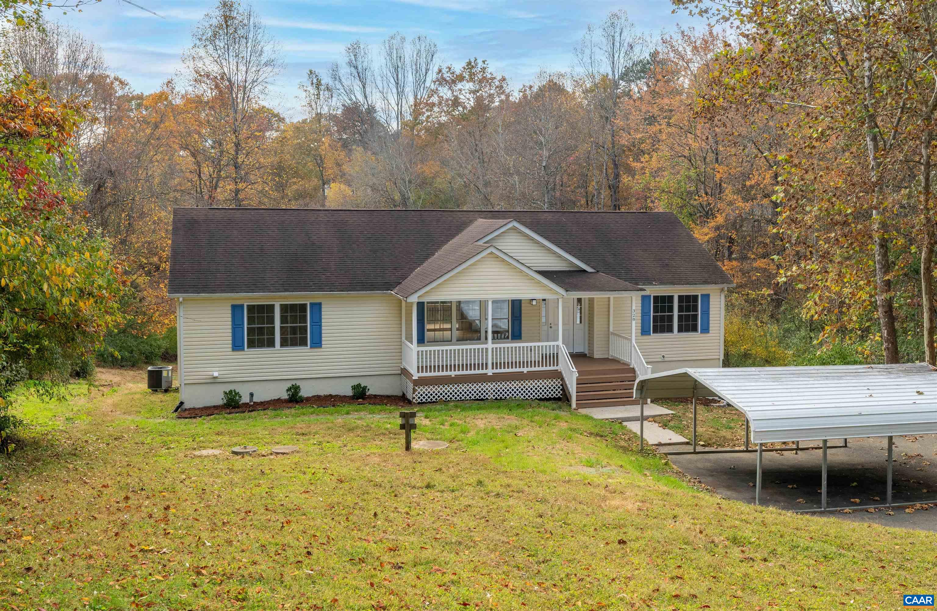 328 West Daffodil Road Ruckersville, VA 22968 - Photo 67 of 67 a front view of a house with a yard table and chairs