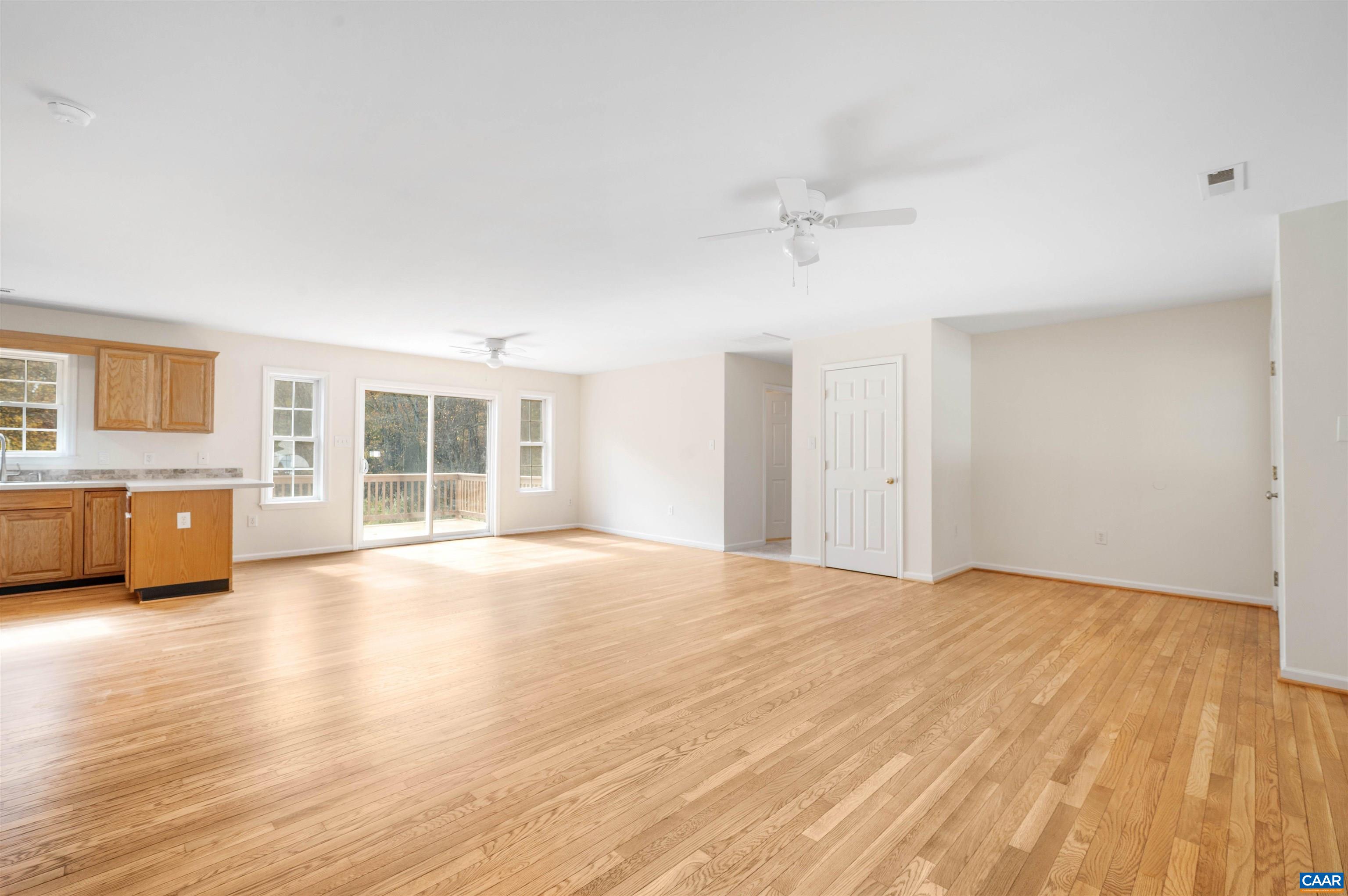 328 West Daffodil Road Ruckersville, VA 22968 - Photo 7 of 67 a view of an empty room with a window and wooden floor