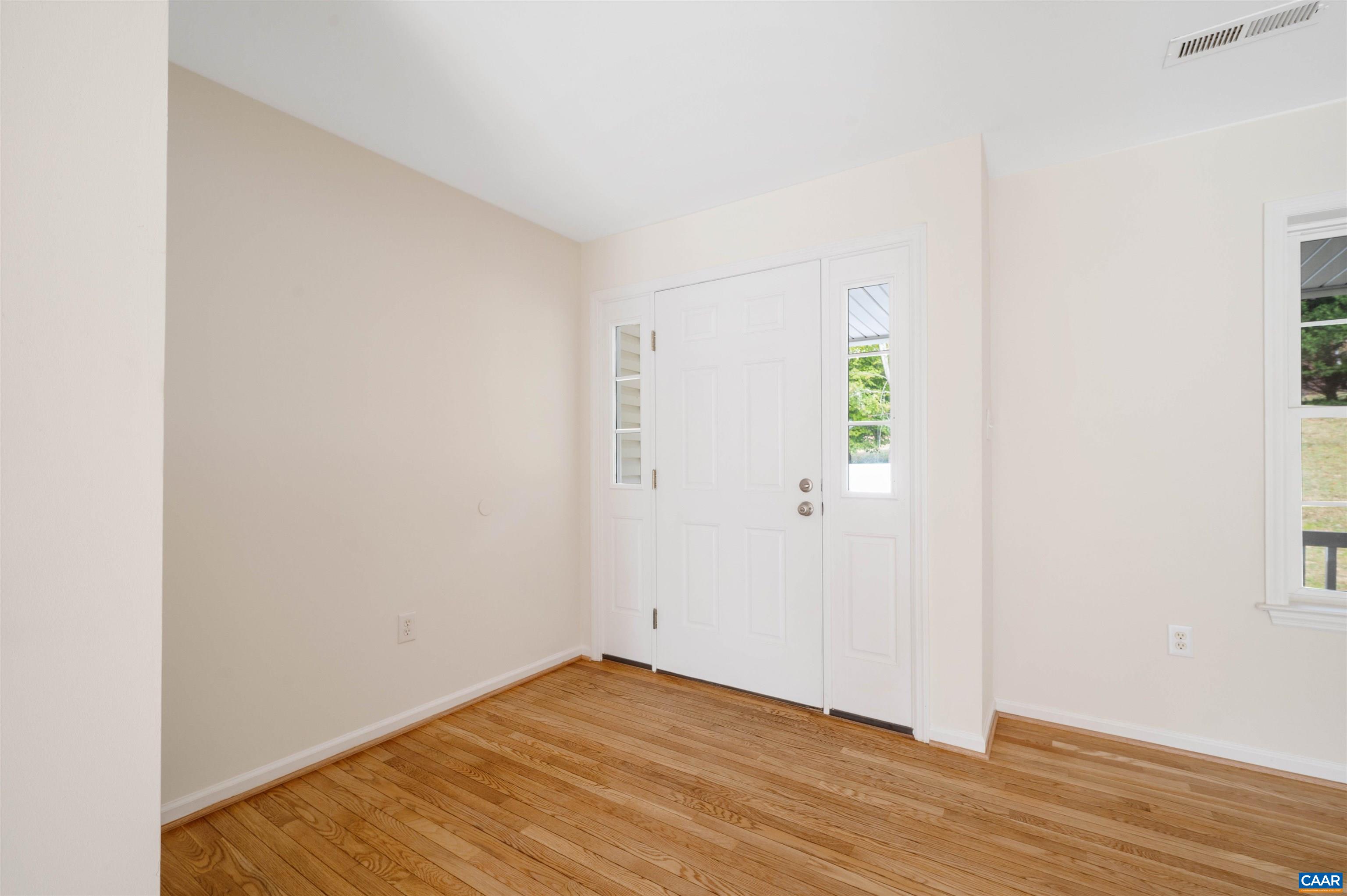 328 West Daffodil Road Ruckersville, VA 22968 - Photo 9 of 67 a view of an empty room with wooden floor