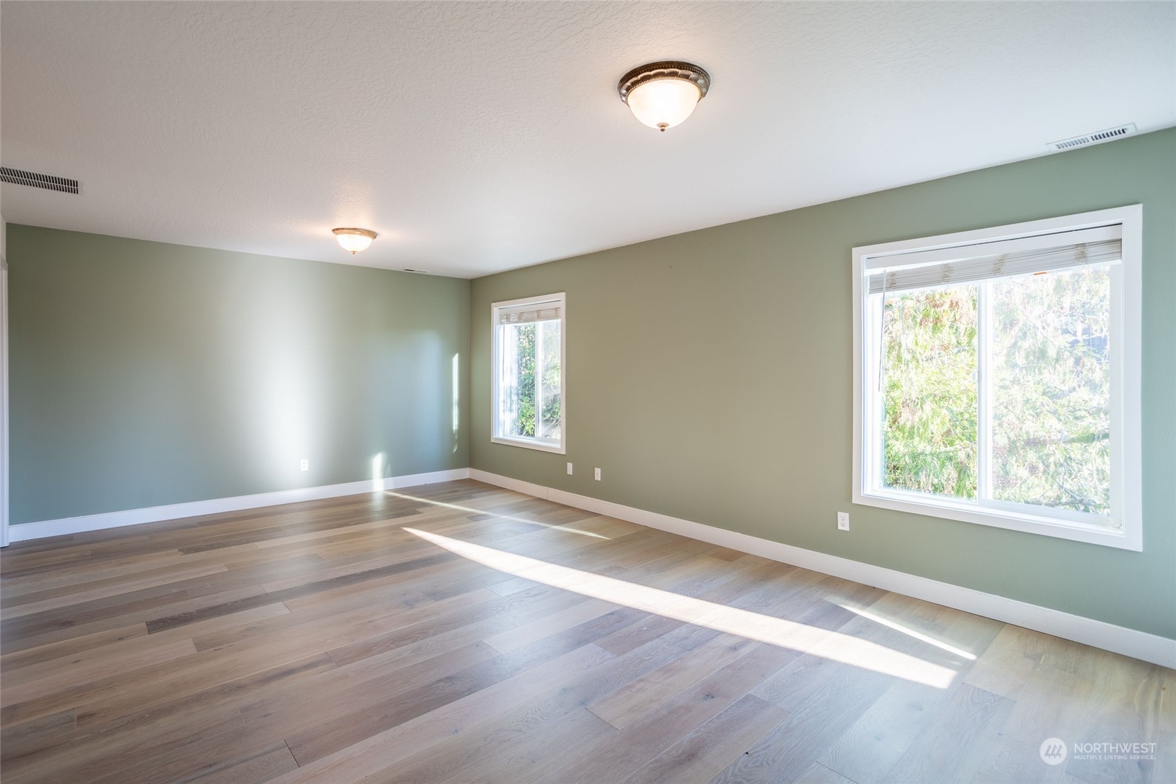 150 Logan Hill Road Chehalis, WA 98532 - Photo 18 of 40 a view of an empty room with wooden floor and a window