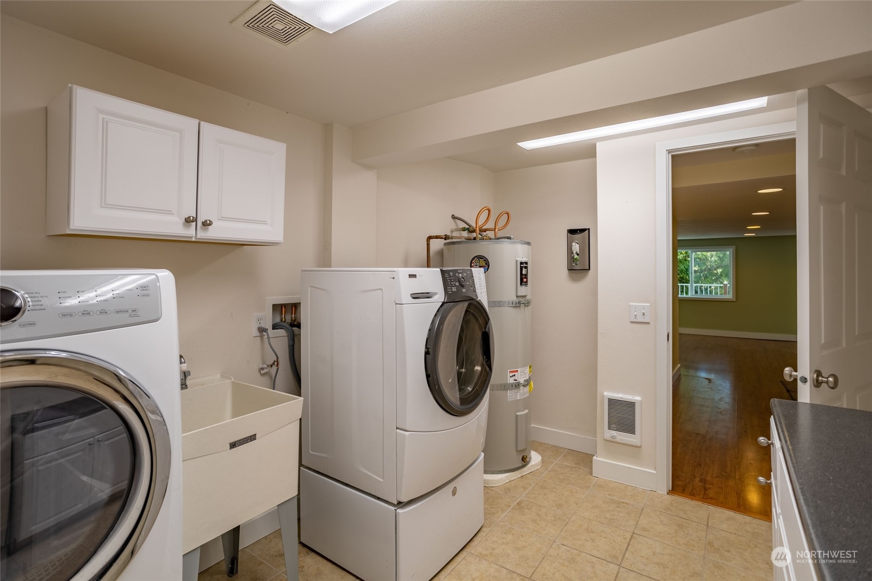 150 Logan Hill Road Chehalis, WA 98532 - Photo 22 of 40 a utility room with dryer washer and a view of bedroom
