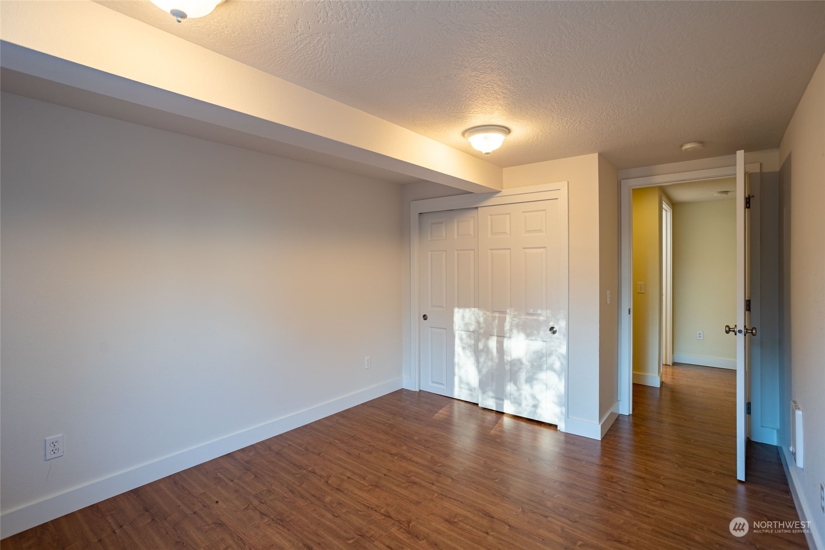 150 Logan Hill Road Chehalis, WA 98532 - Photo 23 of 40 a view of an empty room with wooden floor