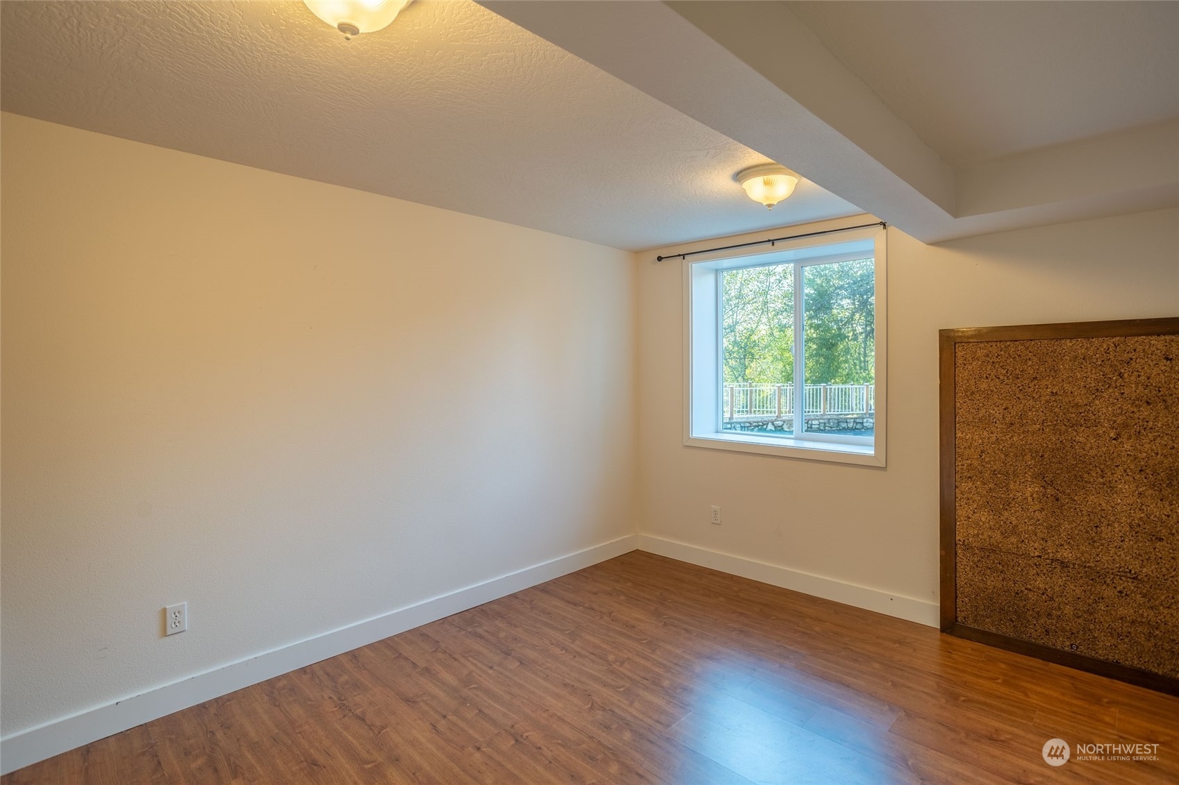 150 Logan Hill Road Chehalis, WA 98532 - Photo 24 of 40 a view of an empty room with wooden floor and a window