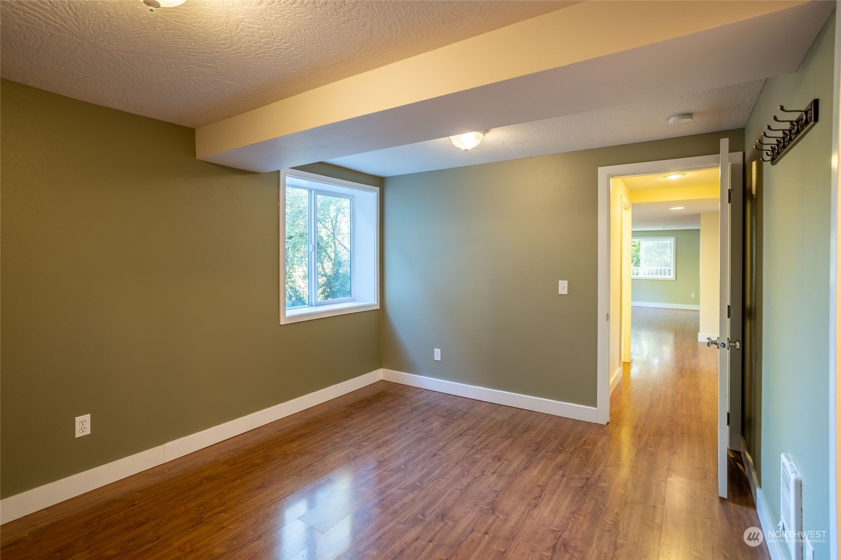 150 Logan Hill Road Chehalis, WA 98532 - Photo 26 of 40 a view of an empty room with wooden floor and a window