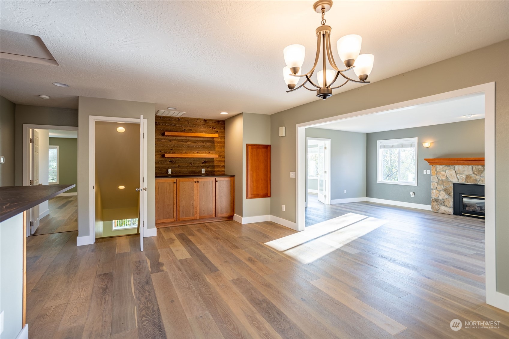150 Logan Hill Road Chehalis, WA 98532 - Photo 5 of 40 a view of a livingroom with wooden floor and kitchen space