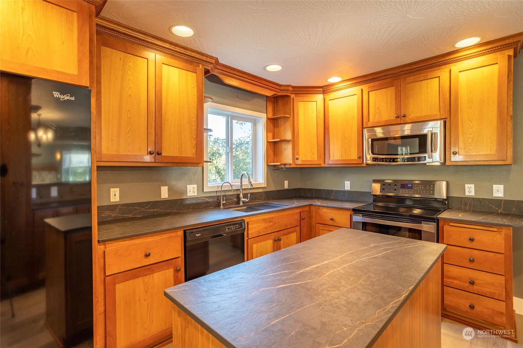 150 Logan Hill Road Chehalis, WA 98532 - Photo 10 of 40 a kitchen with stainless steel appliances granite countertop wooden cabinets and a stove top oven