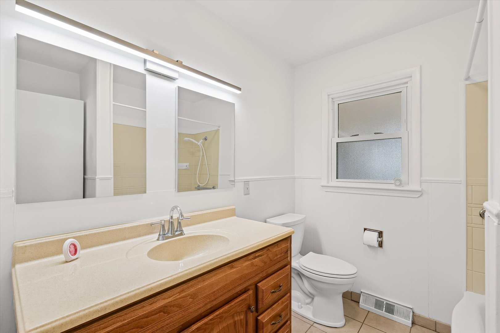 103 West Jefferson Street Philo, IL 61864 - Photo 18 of 36 a bathroom with a granite countertop sink mirror vanity and toilet
