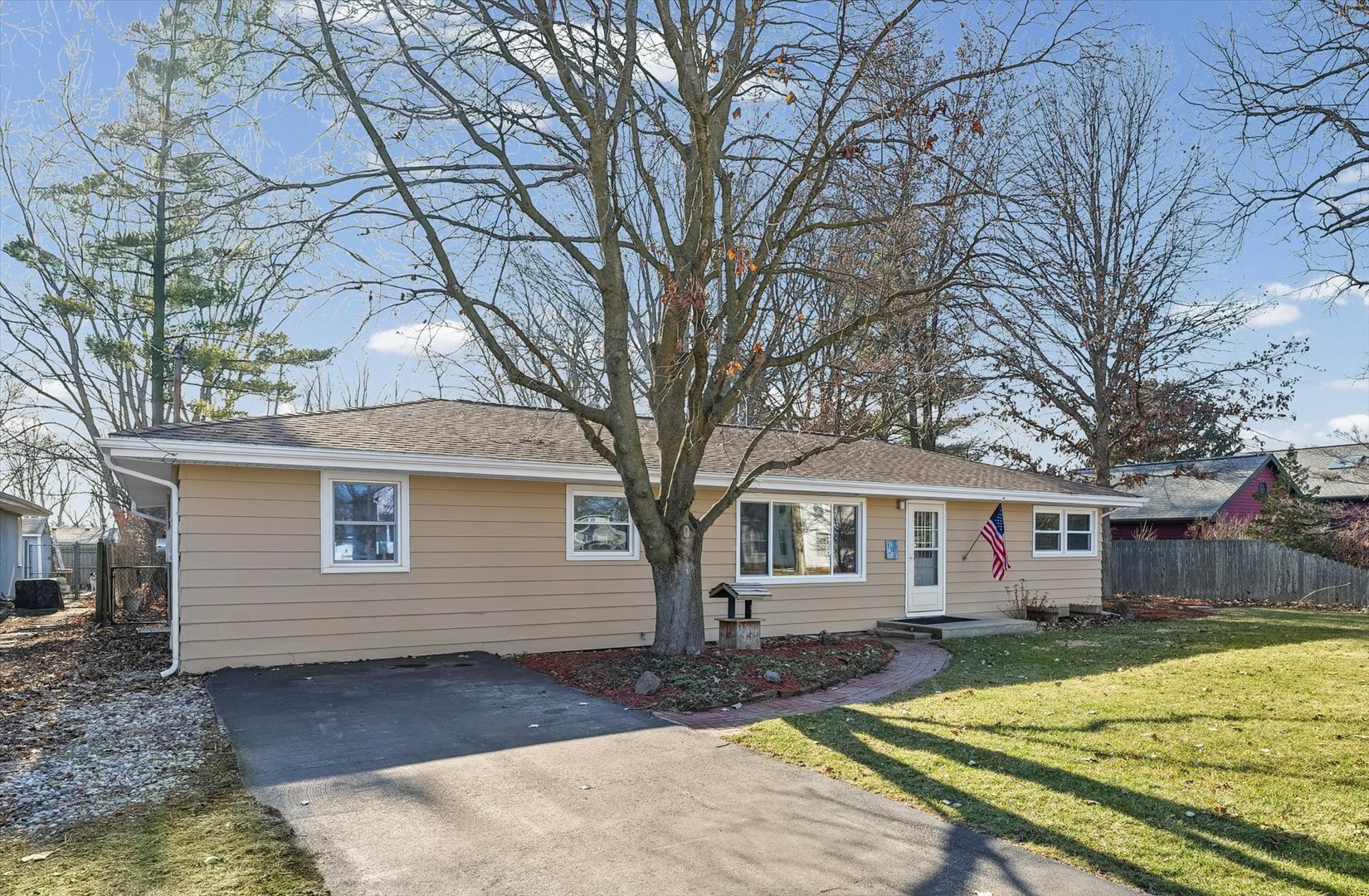103 West Jefferson Street Philo, IL 61864 - Photo 2 of 36 a view of a yard with a house and a large tree