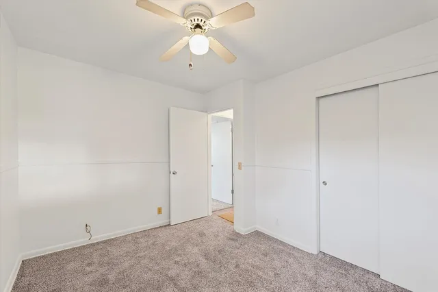 a utility room with cabinets washer and dryer