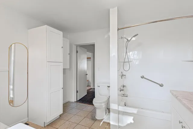 a view of a hallway with a white walls