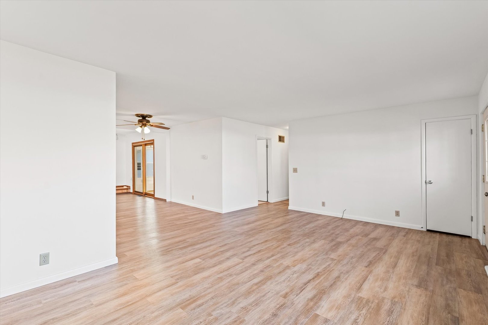 103 West Jefferson Street Philo, IL 61864 - Photo 10 of 36 a view of an empty room and wooden floor