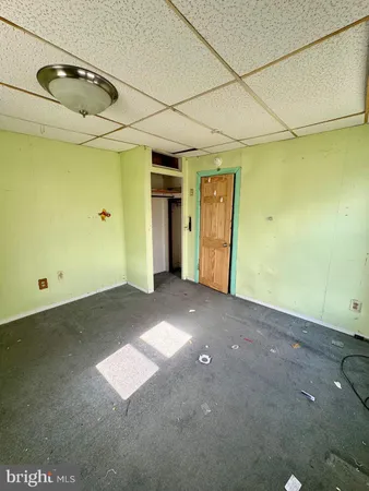 an empty room with a empty space and a window