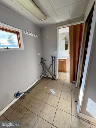 a kitchen with stainless steel appliances kitchen island granite countertop a stove a sink and a refrigerator