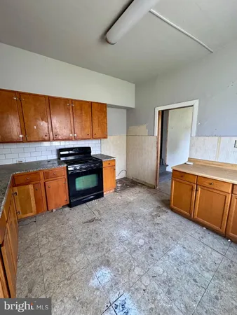 a view of a kitchen with granite countertop cabinets and a sink