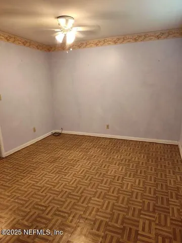 a bathroom with a granite countertop sink and mirror