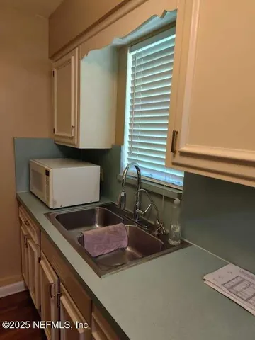 a kitchen with a sink and a stove