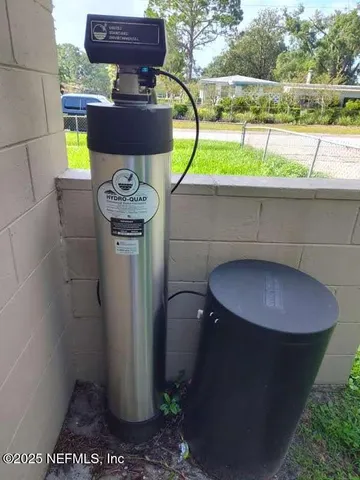 a view of a backyard with a slide and a lake view