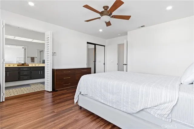 a bathroom with a sink vanity and a mirror