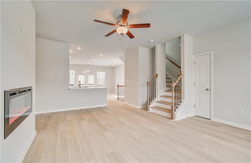 1903 Daybreak Lane Newnan, GA 30265 - Photo 17 of 29 wooden floor in an empty room with a window
