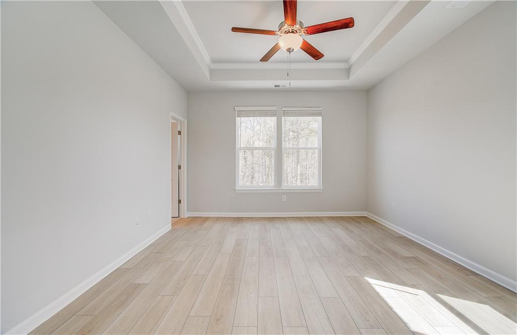 1903 Daybreak Lane Newnan, GA 30265 - Photo 22 of 29 an empty room with a window and a ceiling fan