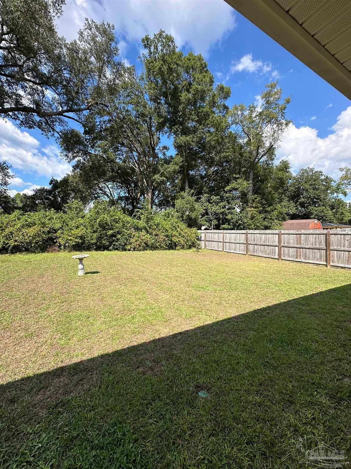 4466 Jude Way Pace, FL 32571 - Photo 27 of 27 Covered Porch in Backyard and Full Privacy Fencing