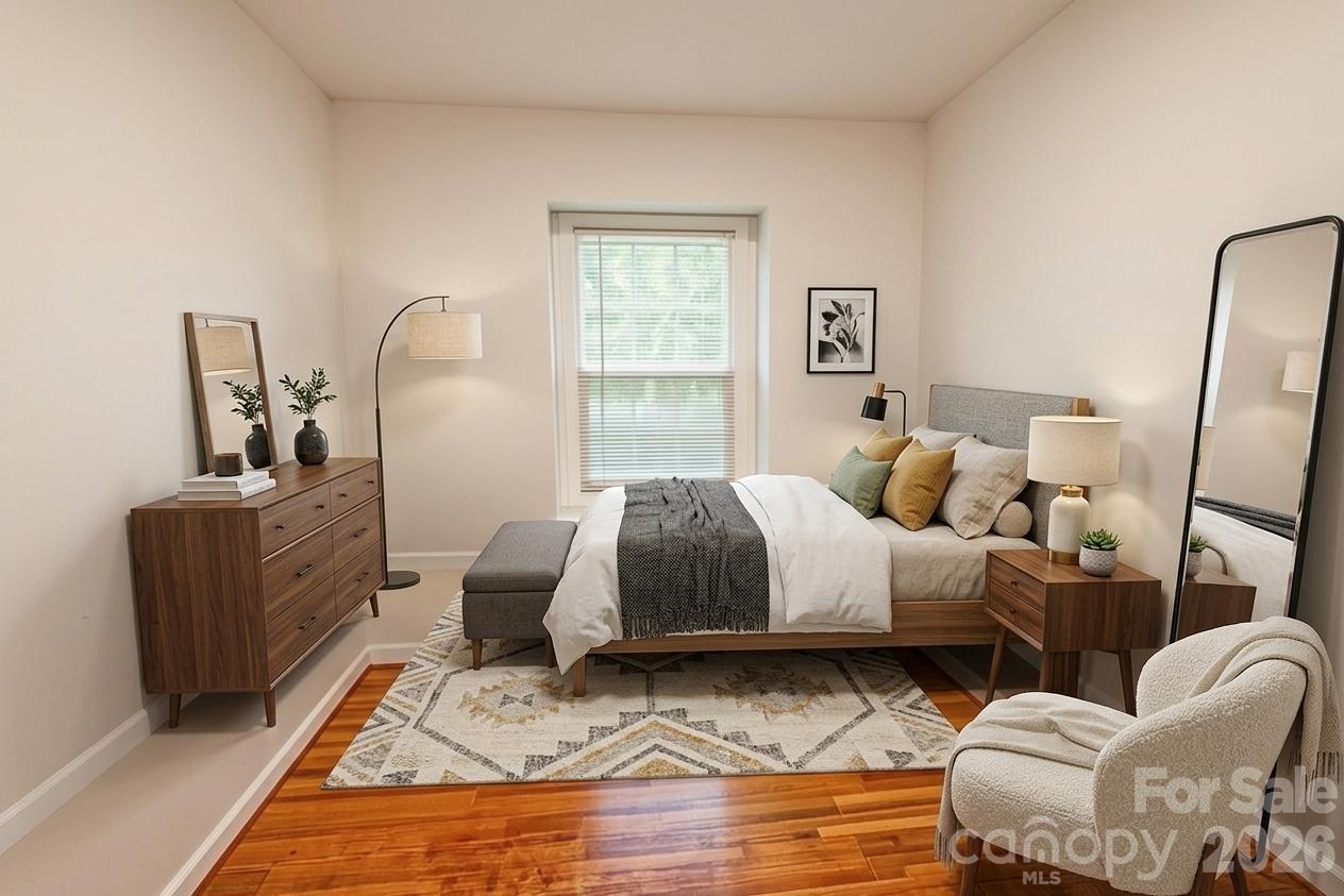 2545 Cedarwild Road Charlotte, NC 28212 - Photo 9 of 25 a bedroom with furniture and wooden floor