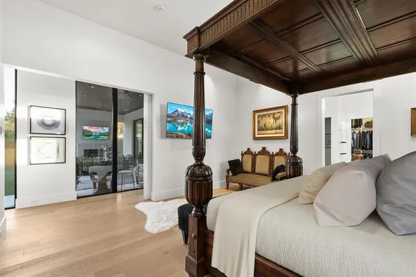 a bathroom with a bathtub shower sink and mirror