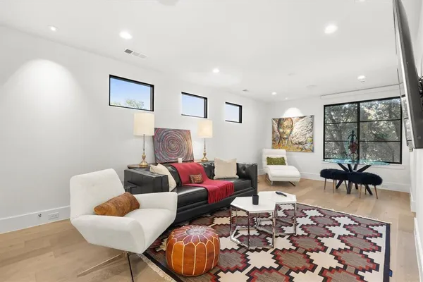 a kitchen with kitchen island granite countertop a table and chairs in it