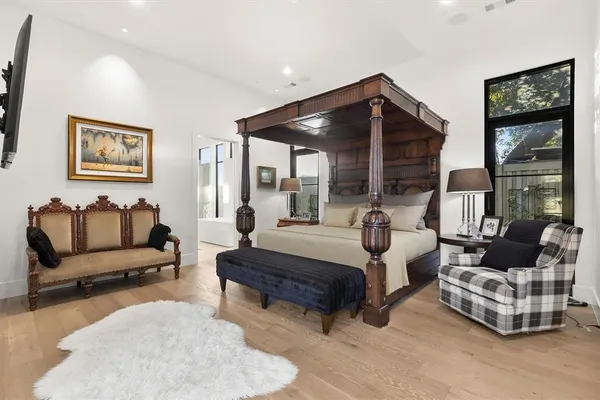 a dining room with furniture and wooden floor