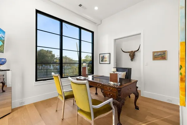 a large kitchen with kitchen island a sink a center island a stove and a living room view