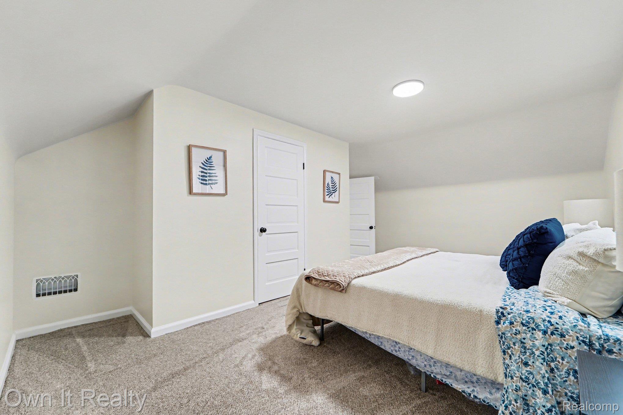 168 Kerby Road Grosse Pointe, MI 48236 - Photo 17 of 36 Bedroom with vaulted ceiling and carpet floors