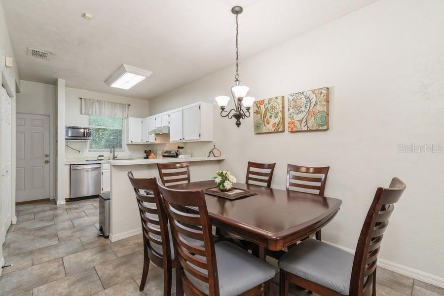 4415 Southwest 34th Street, Unit 204 Gainesville, FL 32608 - Photo 12 of 33 a view of a dining room with furniture