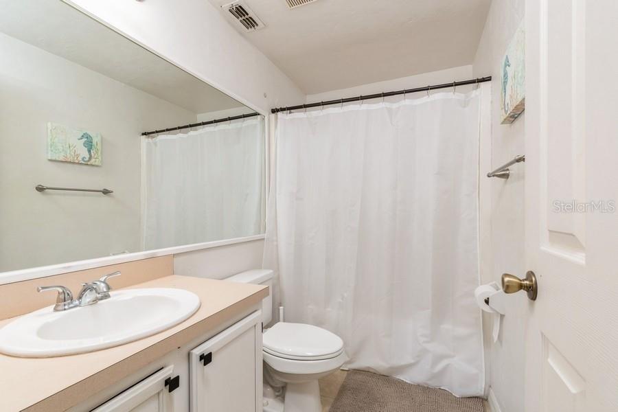 4415 Southwest 34th Street, Unit 204 Gainesville, FL 32608 - Photo 21 of 33 a bathroom with a sink toilet and shower