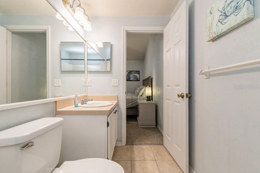 4415 Southwest 34th Street, Unit 204 Gainesville, FL 32608 - Photo 26 of 33 a bathroom with a toilet sink and mirror