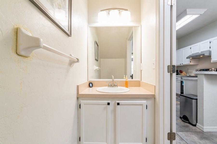 4415 Southwest 34th Street, Unit 204 Gainesville, FL 32608 - Photo 28 of 33 a bathroom with a sink and a mirror