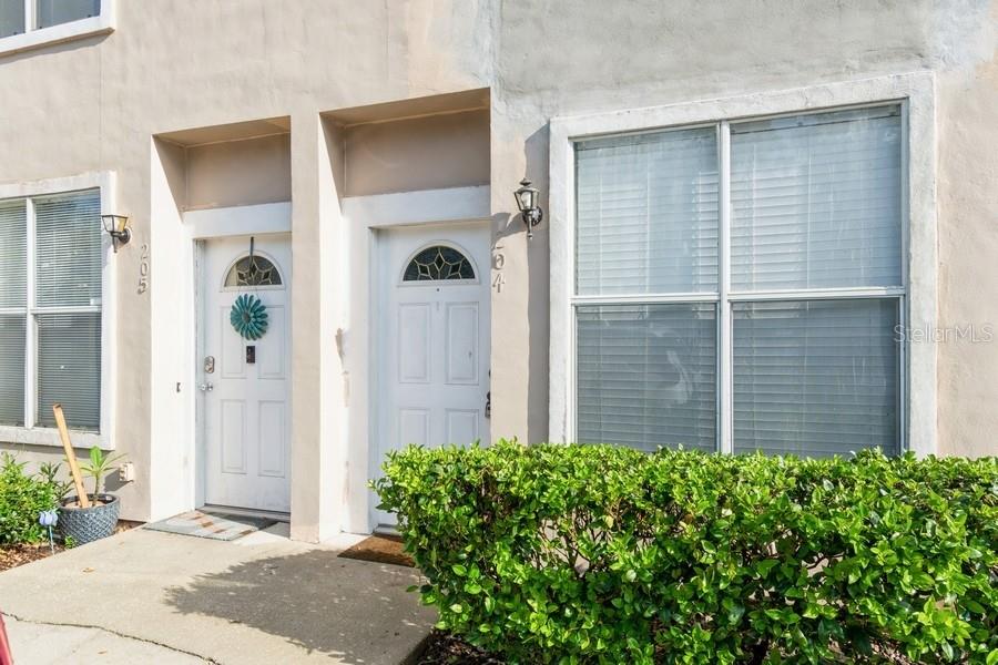 4415 Southwest 34th Street, Unit 204 Gainesville, FL 32608 - Photo 29 of 33 a front view of a house with garden
