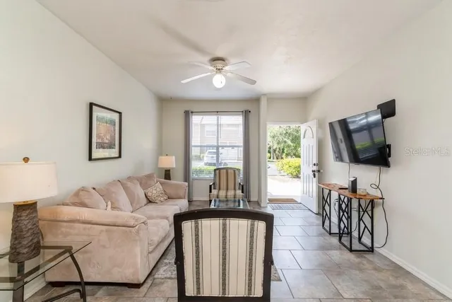 a living room with furniture and a flat screen tv