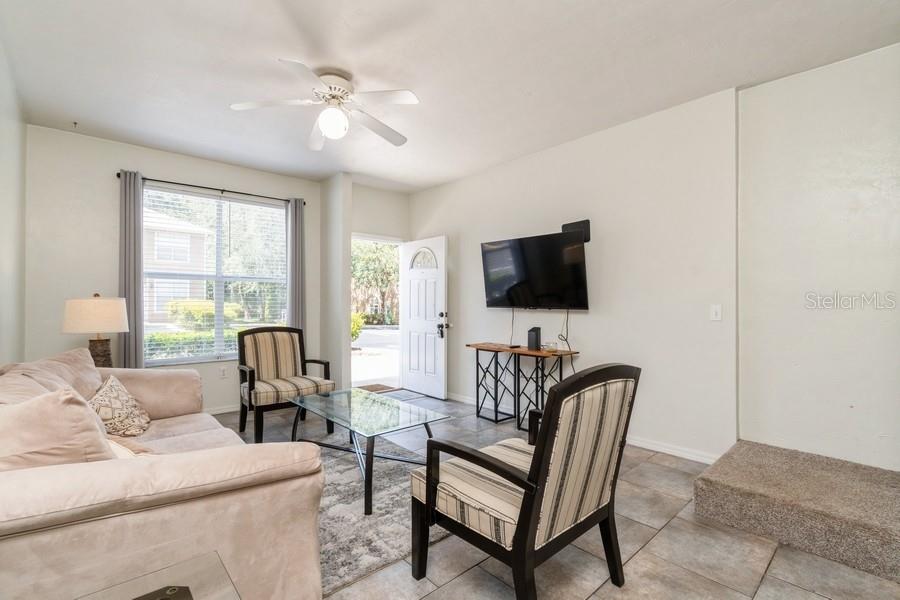 4415 Southwest 34th Street, Unit 204 Gainesville, FL 32608 - Photo 5 of 33 a living room with furniture and a flat screen tv